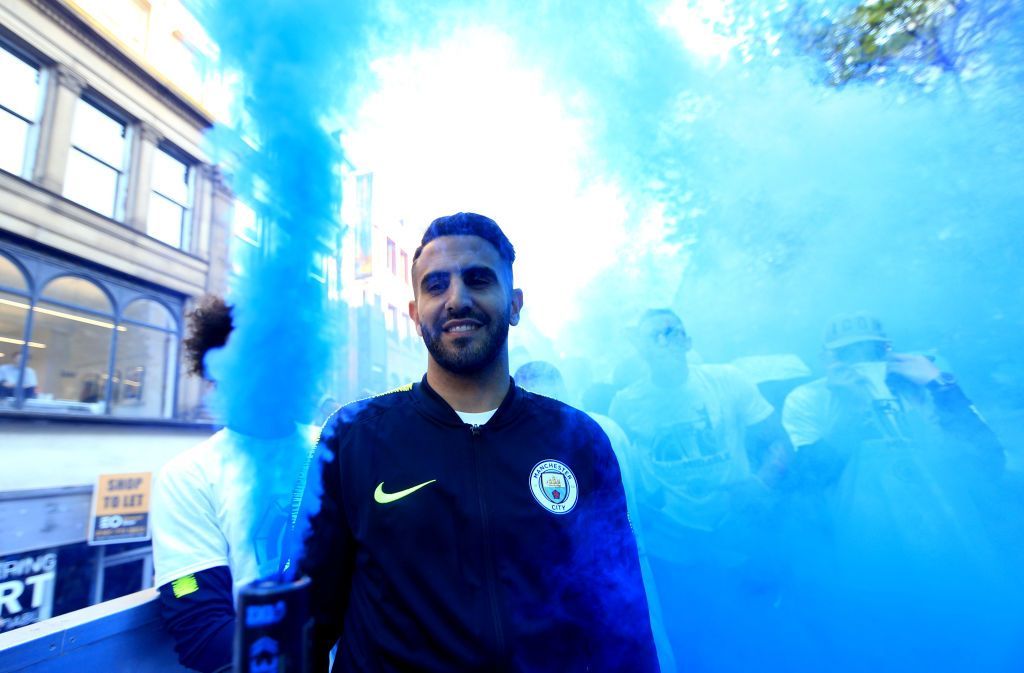 MANCHESTER, ENGLAND - MAY 20: Riyad Mahrez of Manchester City celebrates on board a parade bus during the Manchester City Teams Celebration Parade on May 20, 2019 in Manchester, England. (Photo by Victoria Haydn/Man City via Getty Images)