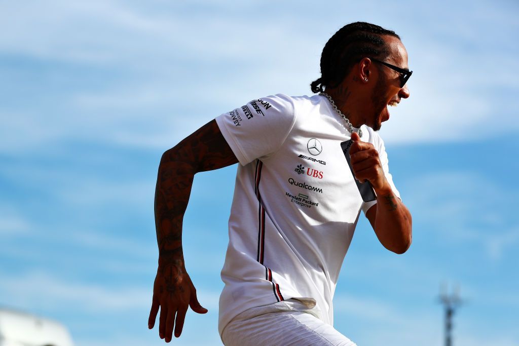 LE CASTELLET, FRANCE - JUNE 23: Race winner Lewis Hamilton of Great Britain and Mercedes GP runs from his team as they spray champagne at the celebrations after the F1 Grand Prix of France at Circuit Paul Ricard on June 23, 2019 in Le Castellet, France. (Photo by Dan Istitene/Getty Images)