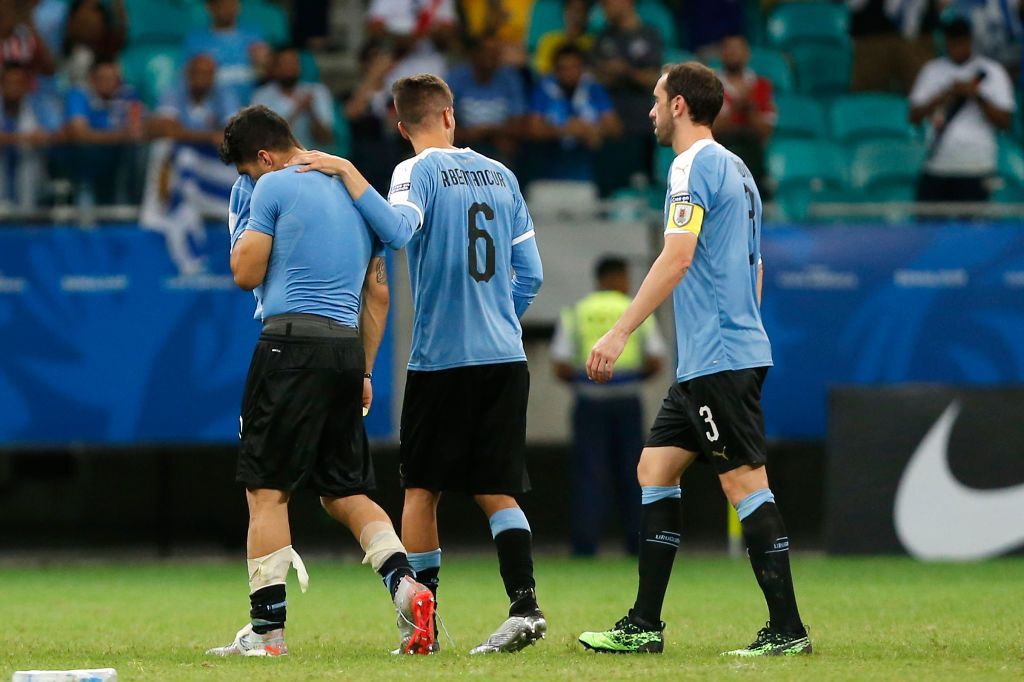 SALVADOR, BRAZIL - JUNE 29: Rodrigo Bentancur of Uruguay comforts teammate Luis Suarez after losing during a penalty shootout after the Copa America Brazil 2019 quarterfinal match between Uruguay and Peru at Arena Fonte Nova on June 29, 2019 in Salvador, Brazil. (Photo by Wagner Meier/Getty Images)