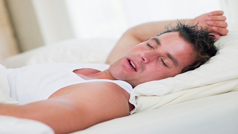 Man lying in bed sleeping