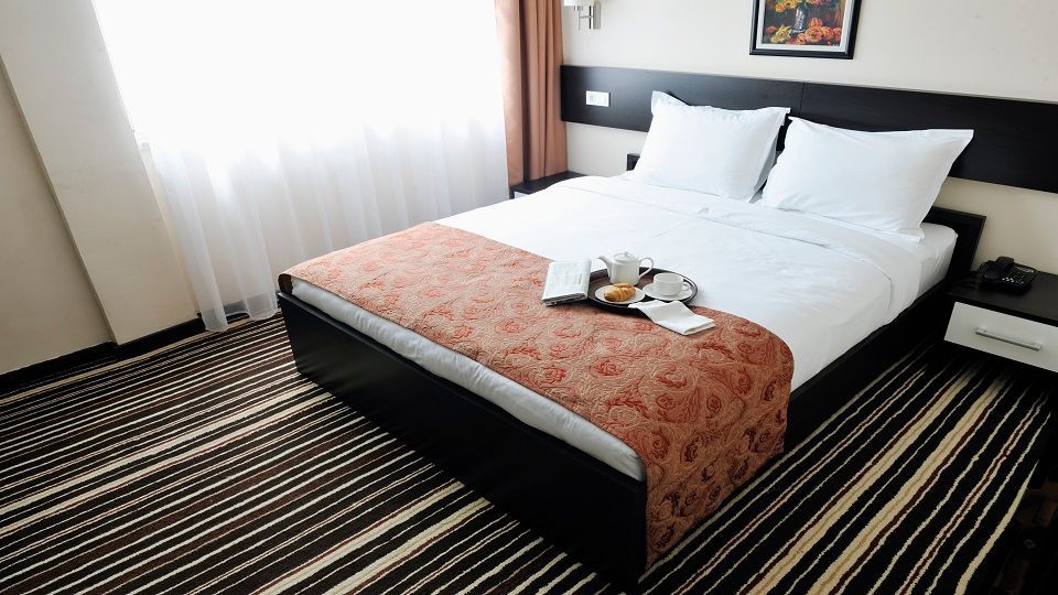 bright and clean hotel room interior with modern furniture