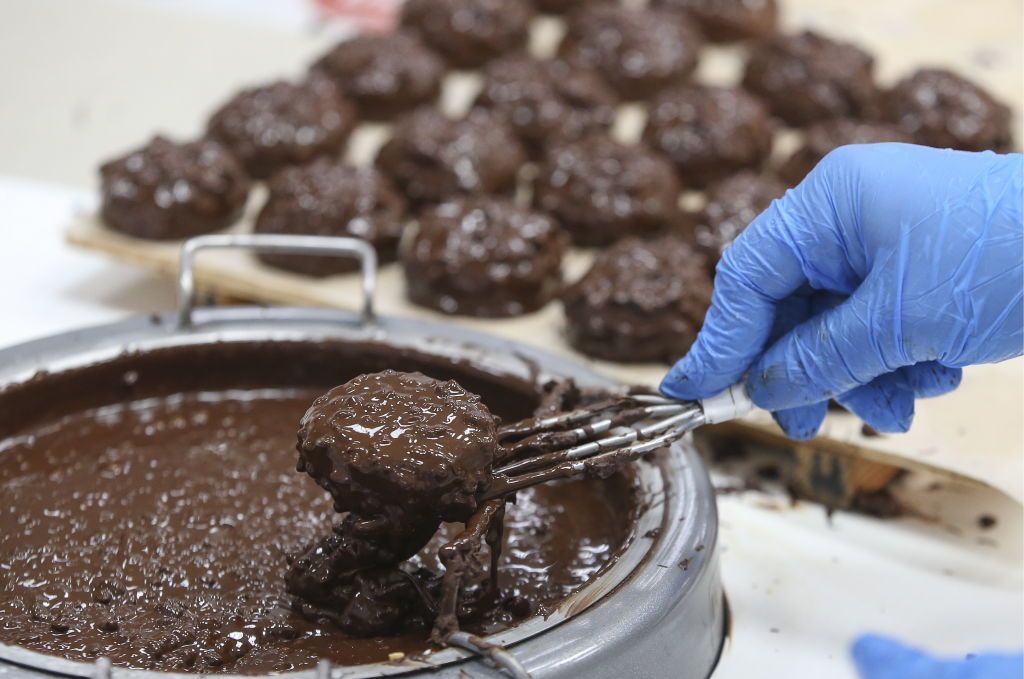 BABRUYSK, BELARUS - JUNE 13, 2019: Zephyr, a marshmallow-like kind of confectionery, being coated with chocolate at the Krasny Pischevik plant. Natalia Fedosenko/TASS (Photo by Natalia FedosenkoTASS via Getty Images)