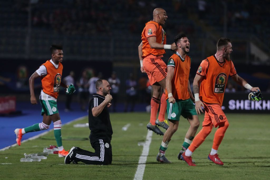 27 June 2019, Egypt, Cairo: Algeria's manager Djamel Belmadi (2-L) and players reacts on the touchline after the final whistle of the 2019 Africa Cup of Nations Group C soccer match between Senegal and Algeria at the 30 June Stadium. Photo: Oliver Weiken/dpa (Photo by Oliver Weiken/picture alliance via Getty Images)