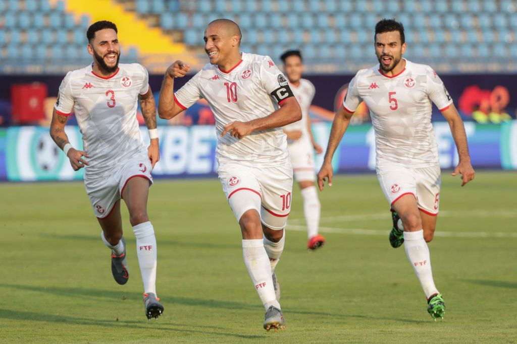 28 June 2019, Egypt, Suez: Tunisia's Wahbi Khazri (C) celebrates with his teammates Dylan Bronn (L) and Oussama Haddadi scoring his side's first goal during the 2019 Africa Cup of Nations Group E soccer match between Tunisia and Mali at Suez Sports Stadium. Photo: Oliver Weiken/dpa (Photo by Oliver Weiken/picture alliance via Getty Images)