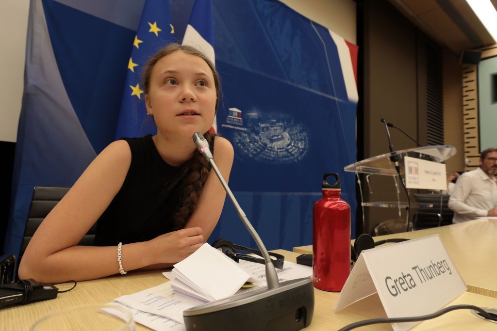 PARIS, FRANCE - JULY 23: Greta Thunberg addresses the National Assembly In Paris on July 23, 2019 in Paris, France. Ms. Thunberg is a Swedish activist who started protesting outside Swedish parliament last year to raise awareness about climate change, inspiring similar student protests around the world. She told the National Assembly that countries and companies had to do more about the climate emergency. (Photo by Micah Garen/Getty Images)