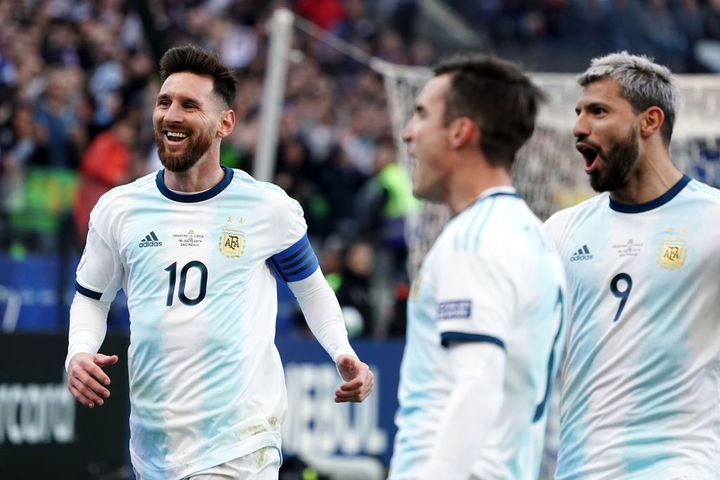 SAO PAULO, BRAZIL - JULY 06: Lionel Messi and Sergio Aguero celebrate the second goal of their team scored by teammate Paulo Dybala (not in frame) during the Copa America Brazil 2019 Third Place match between Argentina and Chile at Arena Corinthians on July 06, 2019 in Sao Paulo, Brazil. (Photo by Koji Watanabe/Getty Images)