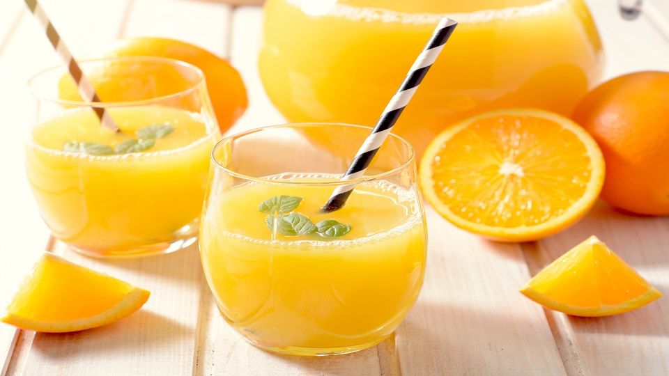 Fresh orange juice in the glasses,selective focus