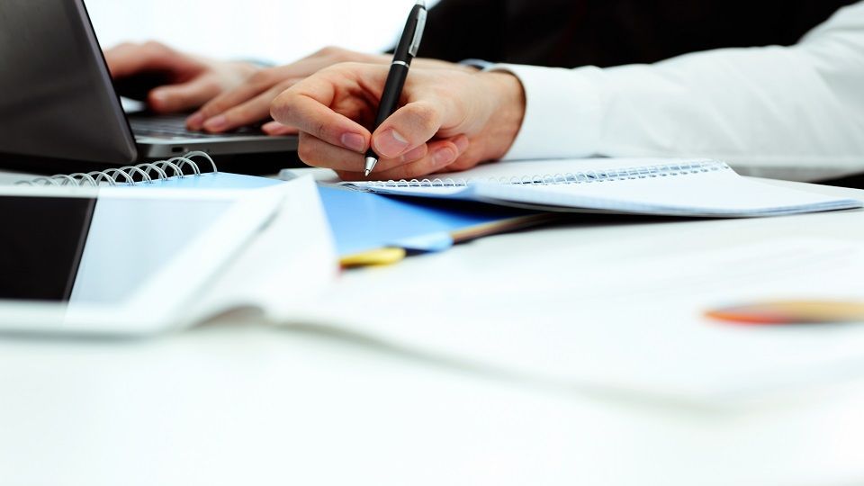 Businesspeople working in office at the table