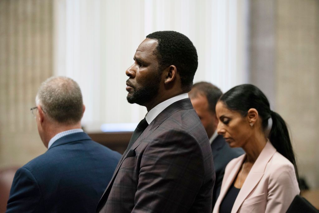 CHICAGO, IL - JUNE 26: R&B singer R. Kelly (C) appears at a hearing before Judge Lawrence Flood at Leighton Criminal Court Building June 26, 2019 in Chicago, Illinois. Prosecutors turned over to Kelly's defense team a DVD that alleges to show Kelly having sex with an underage girl in the 1990s. Kelly has been charged with mulitiple sex crimes involving four women, three of whom were underage at the time of the alleged encounters. (Photo by E. Jason Wambsgans-Pool/Getty Images)