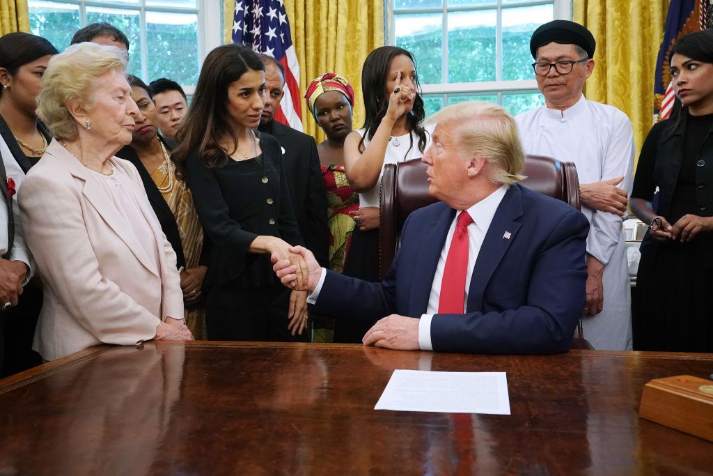 WASHINGTON, DC - JULY 17: U.S. President Donald Trump shakes hands with Iraqi Yazidi human rights activist and Nobel Peace Prize winner Nadia Murad of Iraq while he hosts her and other survivors of religious persecution from 17 countries around the world in the Oval Office at the White House July 17, 2019 in Washington, DC. The survivors are in Washington to attend a State Department conference on religious freedom. (Photo by Chip Somodevilla/Getty Images)