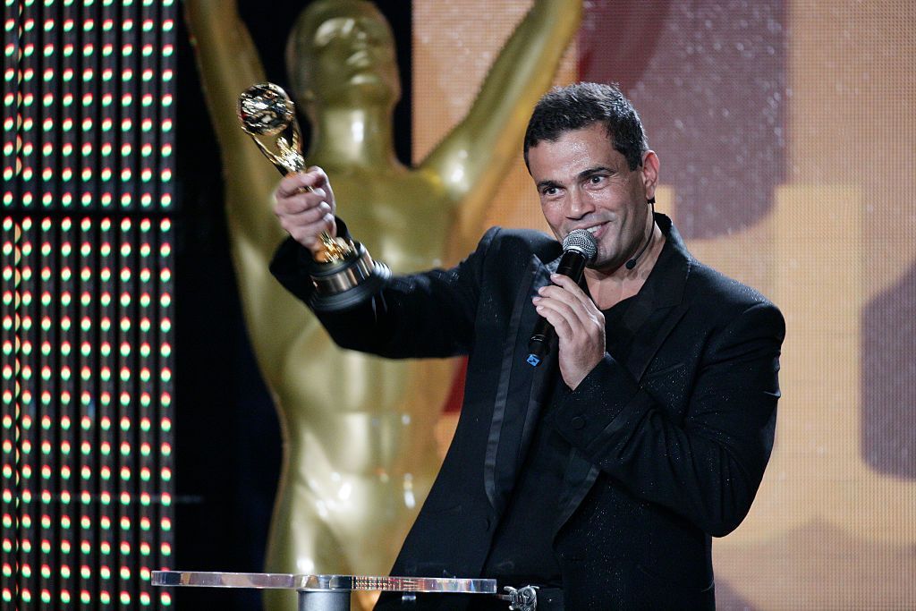 Amr Diab receives an award during the World Music Awards 2007 in Monte Carlo. (Photo by Stephane Cardinale/Corbis via Getty Images)