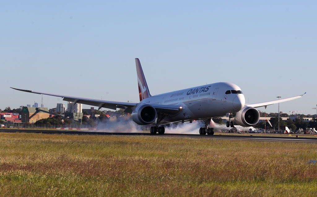 SYDNEY, AUSTRALIA - OCTOBER 20: Qantas flight 7879 lands at Sydney Airport after flying 19 hours and 16 minutes from New York to Sydney on October 20, 2019 in Sydney, Australia. Qantas is the first commercial airline to ever fly direct from New York to Sydney. The flight was restricted to 40 people plus 10 crew to increase aircraft range, and included medical scientists and health experts on board to conduct studies in the cockpit and the cabin to help determine strategies to promote long haul inflight health and wellbeing on ultra-long haul flights. It comes as the national carrier continues to work towards the final frontier of global aviation by launching non-stop commercial flights between the US and the UK to the east coast of Australia in an ambitious project dubbed "Project Sunrise". (Photo by James D. Morgan/Getty Images for Qantas)