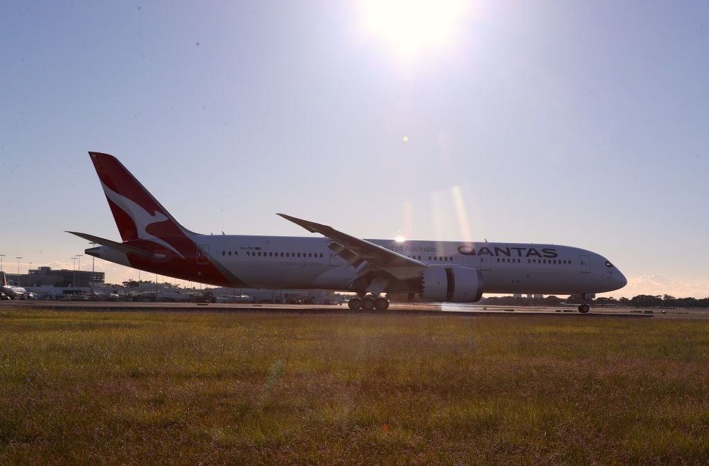 SYDNEY, AUSTRALIA - OCTOBER 20: Qantas flight 7879 lands at Sydney Airport after flying 19 hours and 16 minutes from New York to Sydney on October 20, 2019 in Sydney, Australia. Qantas is the first commercial airline to ever fly direct from New York to Sydney. The flight was restricted to 40 people plus 10 crew to increase aircraft range, and included medical scientists and health experts on board to conduct studies in the cockpit and the cabin to help determine strategies to promote long haul inflight health and wellbeing on ultra-long haul flights. It comes as the national carrier continues to work towards the final frontier of global aviation by launching non-stop commercial flights between the US and the UK to the east coast of Australia in an ambitious project dubbed "Project Sunrise". (Photo by James D. Morgan/Getty Images for Qantas)