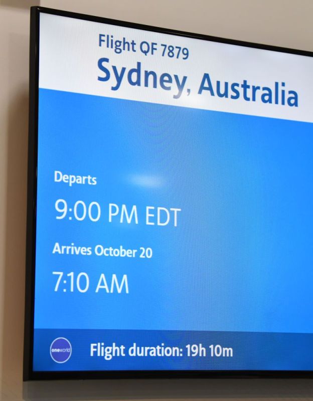 NEW YORK, NY - OCTOBER 18: Flight departure screens at JFK airport for QF7879 on October 18, 2019 in New York, NY. Qantas is the first commercial airline to ever fly direct from New York to Sydney. The 19-hour flight was restricted to 40 people maximum to increase aircraft range, and included medical scientists and health experts on board to conduct studies in the cockpit and the cabin to help determine strategies to promote long haul inflight health and wellbeing on ultra-long haul flights. It comes as the national carrier continues to work towards the final frontier of global aviation by launching non-stop commercial flights between the US and the UK to the east coast of Australia in an ambitious project dubbed "Project Sunrise". (Photo by James D. Morgan/Getty Images for Qantas)