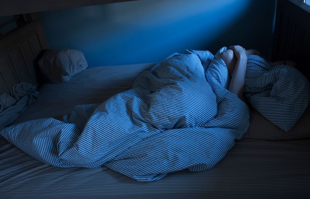 BROOKLYN, NY - JANUARY 13: A teenage boy sleeps through most of the late morning on January 13, 2018 in his home in Brooklyn, New York.  (Photo by Andrew Lichtenstein/ Corbis via Getty Images)