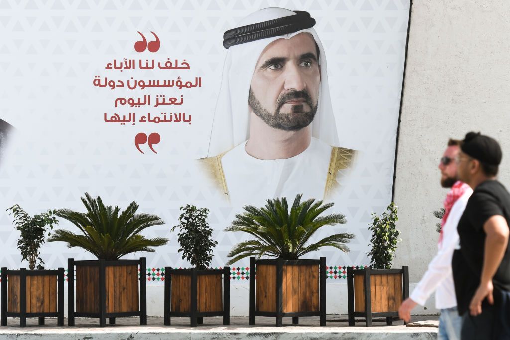 الشيخ محمد بن راشد: 14 عاماً من القيادة الحكيمة والخبرة العالية 1 People walk next to a mural with an image of Mohammed bin Rashid Al Maktoum, the Vice President of the United Arab Emirates, in Abu Dhabi Marina area, close to the finish line of the second stage of UAE Tour 2019, the Special Olympics World Games Abu Dhabi stage, a 184km with a start in Yas Island and finish near Yas Waterworld. On Monday, February 25, 2019, Abu Dhabi, United Arab Emirates. (Photo by Artur Widak/NurPhoto via Getty Images)
