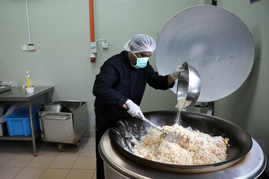 A chef prepares food at Mychef halal food factory in Kuala Lumpur, Malaysia, December 6, 2019. Picture taken December 6, 2019. REUTERS/Lim Huey Teng