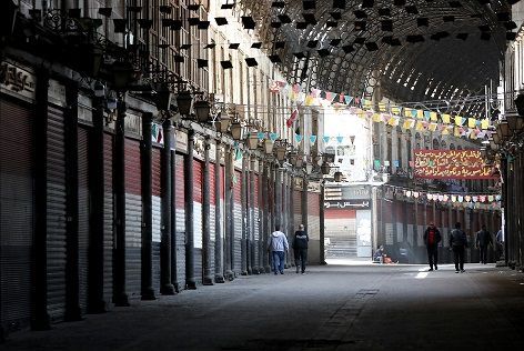 Only a few people walk in the century-old covered bazaar of Hamidiya in Syria's capital Damascus on March 24, 2020, after measures were taken by the authorities to fight the novel coronavirus pandemic. - Across much of the Syrian capital, with squares and markets once thronging with people even during the war, are now almost entirely empty. Five cases of COVID-19 have been reported in the country since Sunday, and the authorities have ordered all non-essential businesses closed. 