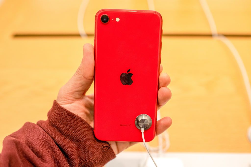 TAIPEI, TAIWAN - 2020/04/24: A customer seen holding an iPhone SE red version at an Apple retail store. Apple launched sales of its latest iPhone SE around the world. (Photo by Walid Berrazeg/SOPA Images/LightRocket via Getty Images)