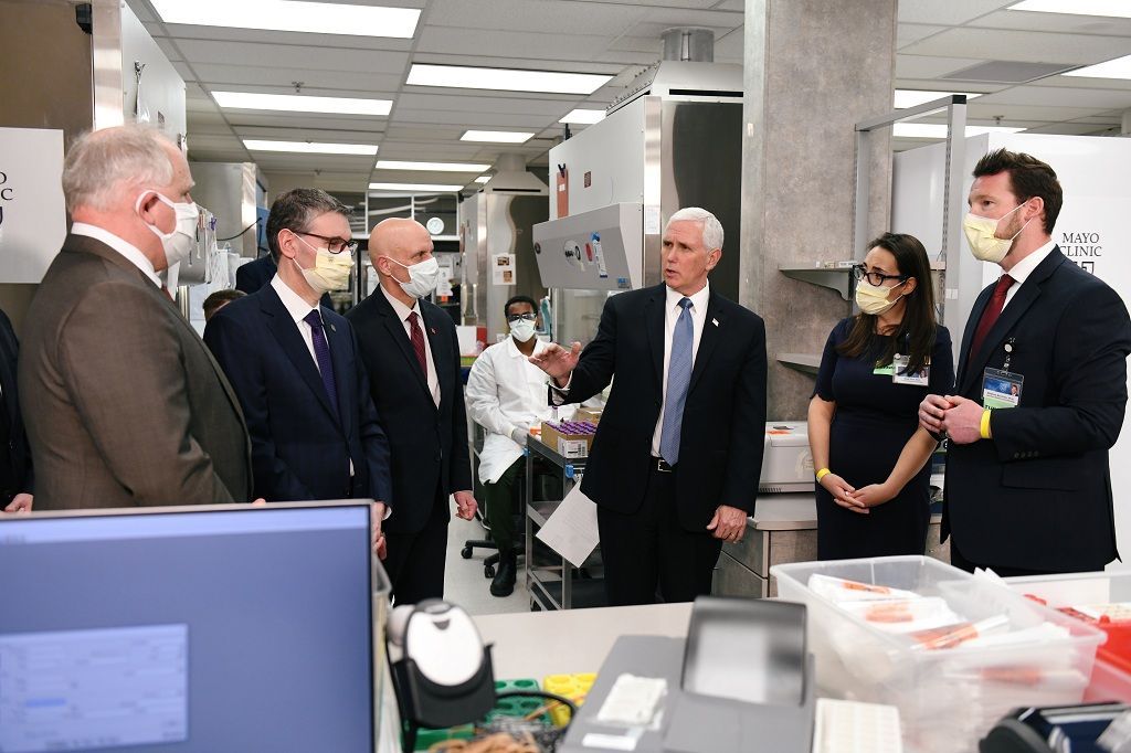 Vice President Mike Pence visits with lab physicians and techs while touring Mayo Clinic facilities supporting coronavirus disease (COVID-19) research and treatment in Rochester, Minnesota, U.S., April 28, 2020. REUTERS/Nicholas Pfosi