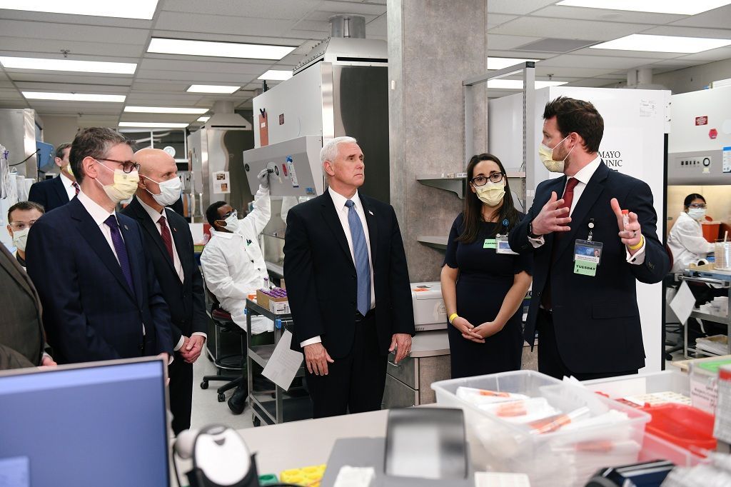 Vice President Mike Pence visits with lab physicians and techs while touring Mayo Clinic facilities supporting coronavirus disease (COVID-19) research and treatment in Rochester, Minnesota, U.S., April 28, 2020. REUTERS/Nicholas Pfosi