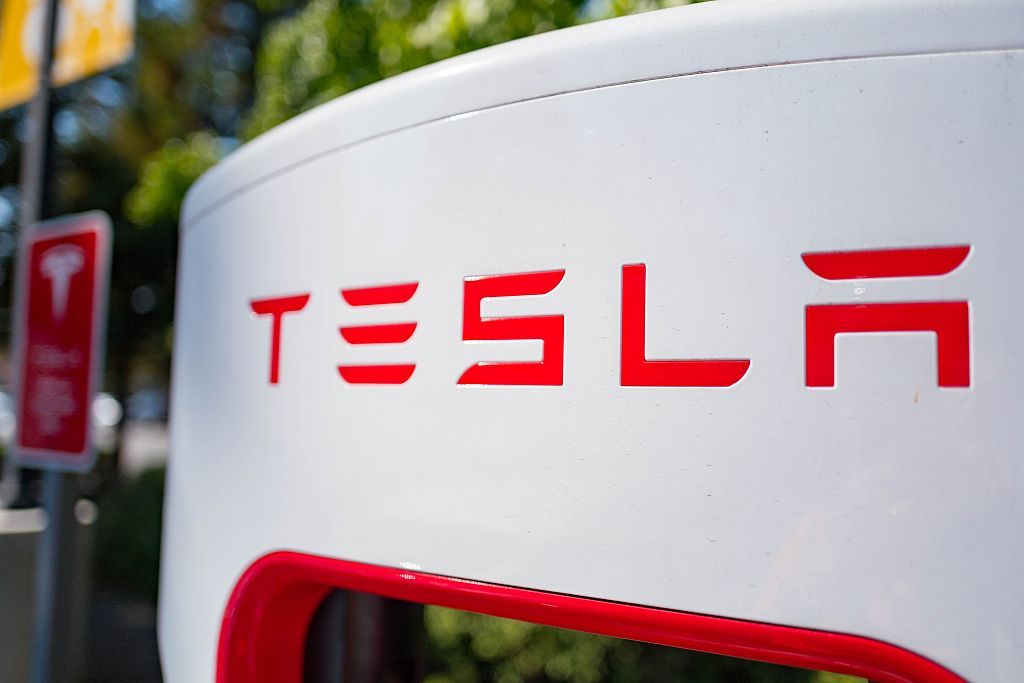 Close up of Tesla logo on a charger at a Supercharger rapid battery charging station for the electric vehicle company Tesla Motors, in the Silicon Valley town of Mountain View, California, August 24, 2016. (Photo by Smith Collection/Gado/Getty Images).