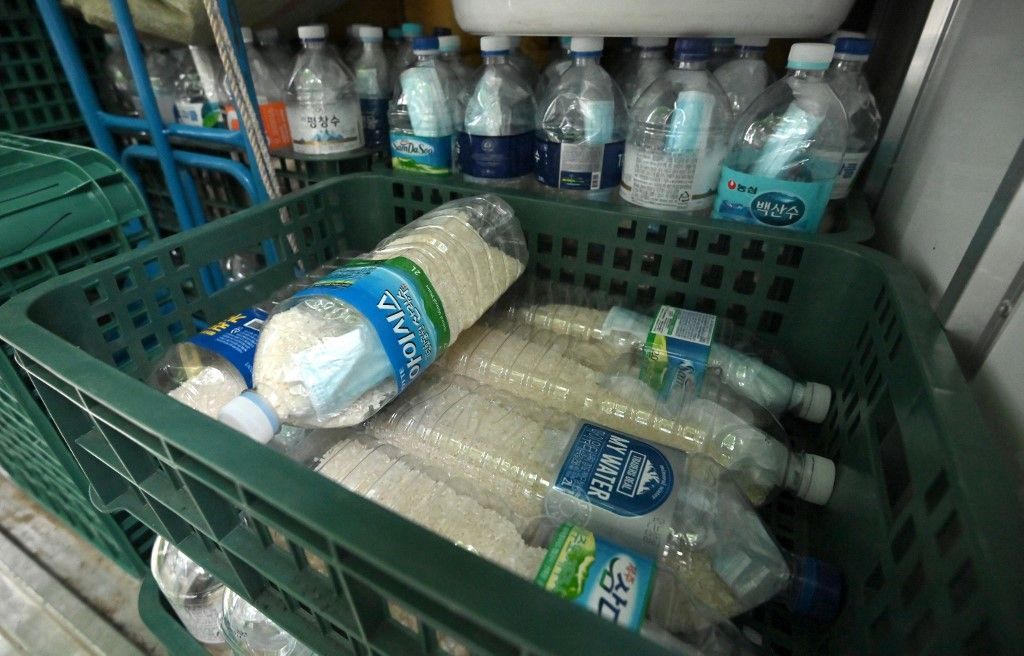 Plastic bottles filled with rice and face masks are loaded on a truck of North Korean defector Park Jung-oh as he prepares a plan to send the bottles towards North Korea through a border river, in Seoul on June 18, 2020. - North Korea's destruction of its liaison office with the South came after Pyongyang vehemently condemned Seoul for anti-Pyongyang leaflets sent by defectors into the North. (Photo by Jung Yeon-je / AFP)