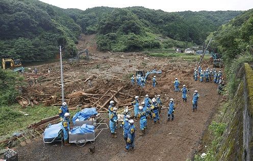 Police officers search for missing people at a landslide site caused by a heavy rain in Tsunagi town, Kumamoto prefecture, southern Japan, in this photo taken by Kyodo July 5, 2020. Mandatory credit Kyodo/via REUTERS ATTENTION EDITORS - THIS IMAGE WAS PROVIDED BY A THIRD PARTY. MANDATORY CREDIT. JAPAN OUT. NO COMMERCIAL OR EDITORIAL SALES IN JAPAN.