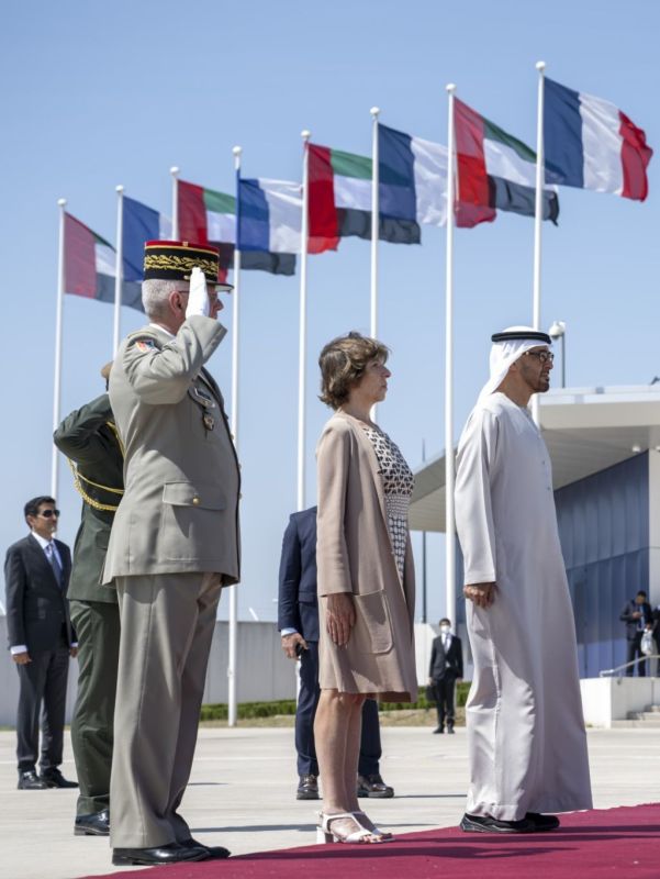 PARIS, FRANCE - July 19, 2022: HH Sheikh Mohamed bin Zayed Al Nahyan, President of the United Arab Emirates (R) stand for the national anthem,concluding an official state visit to France. Seen with HE Catherine Colonna, Minister for Europe and Foreign Affairs (L).<br /> ( Hamad Al Kaabi / Presidential Court )<br /> ---